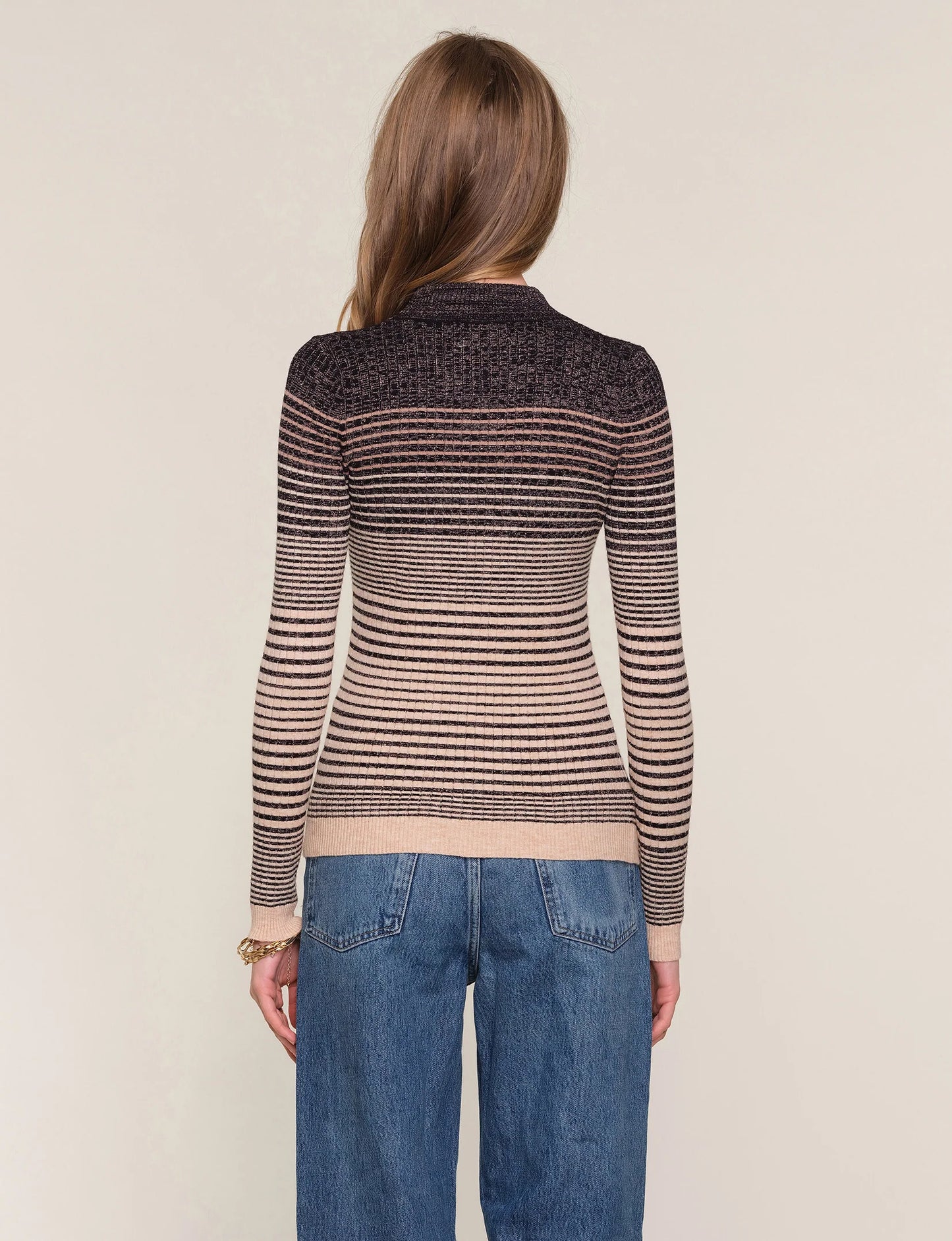 slim fit, crew neck sweater. It features an ombre stitch detail with a metallic thread throughout.