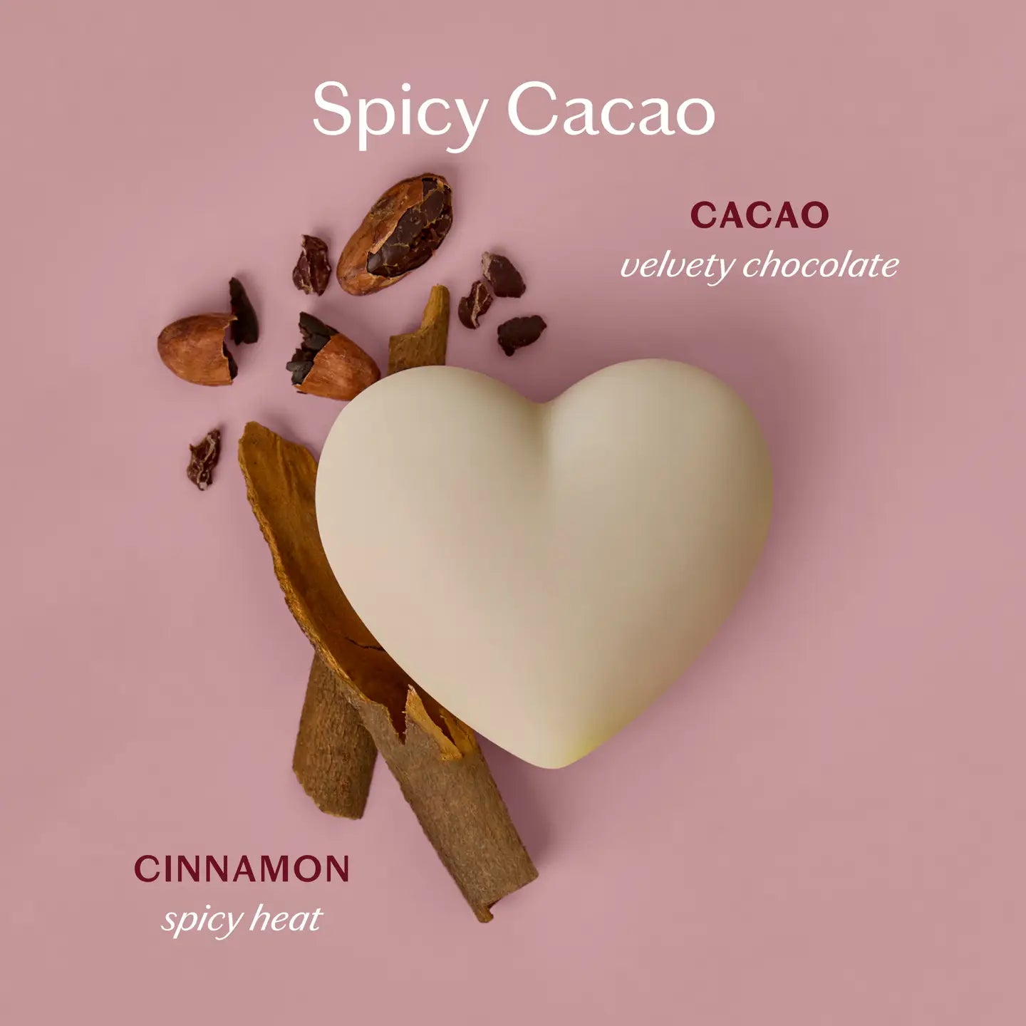 Heart-shaped cacao lotion body bar with cinnamon sticks on a pink background, labeled 'Spicy Cacao'.