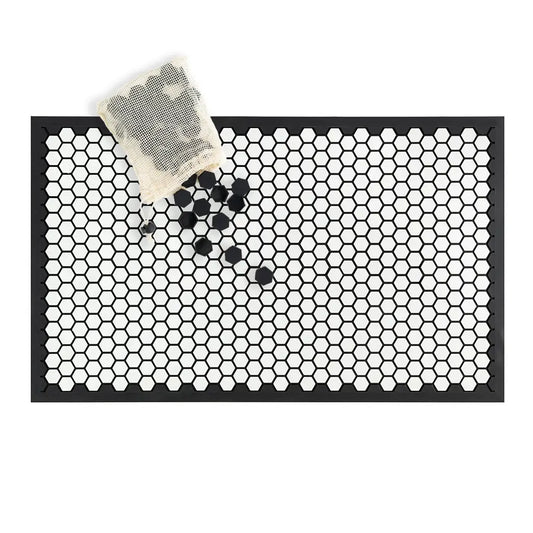Black doormat with white hexagonal pattern on a white background
