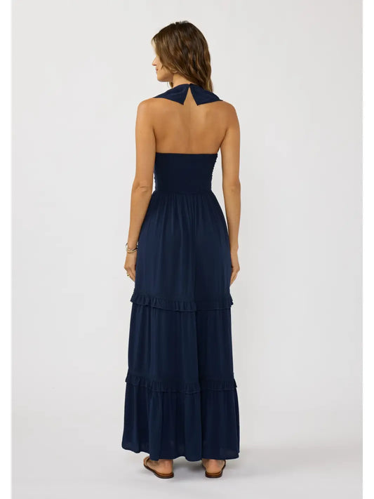 Back view of a flowy bohemian maxi dress featuring soft ruffle trims