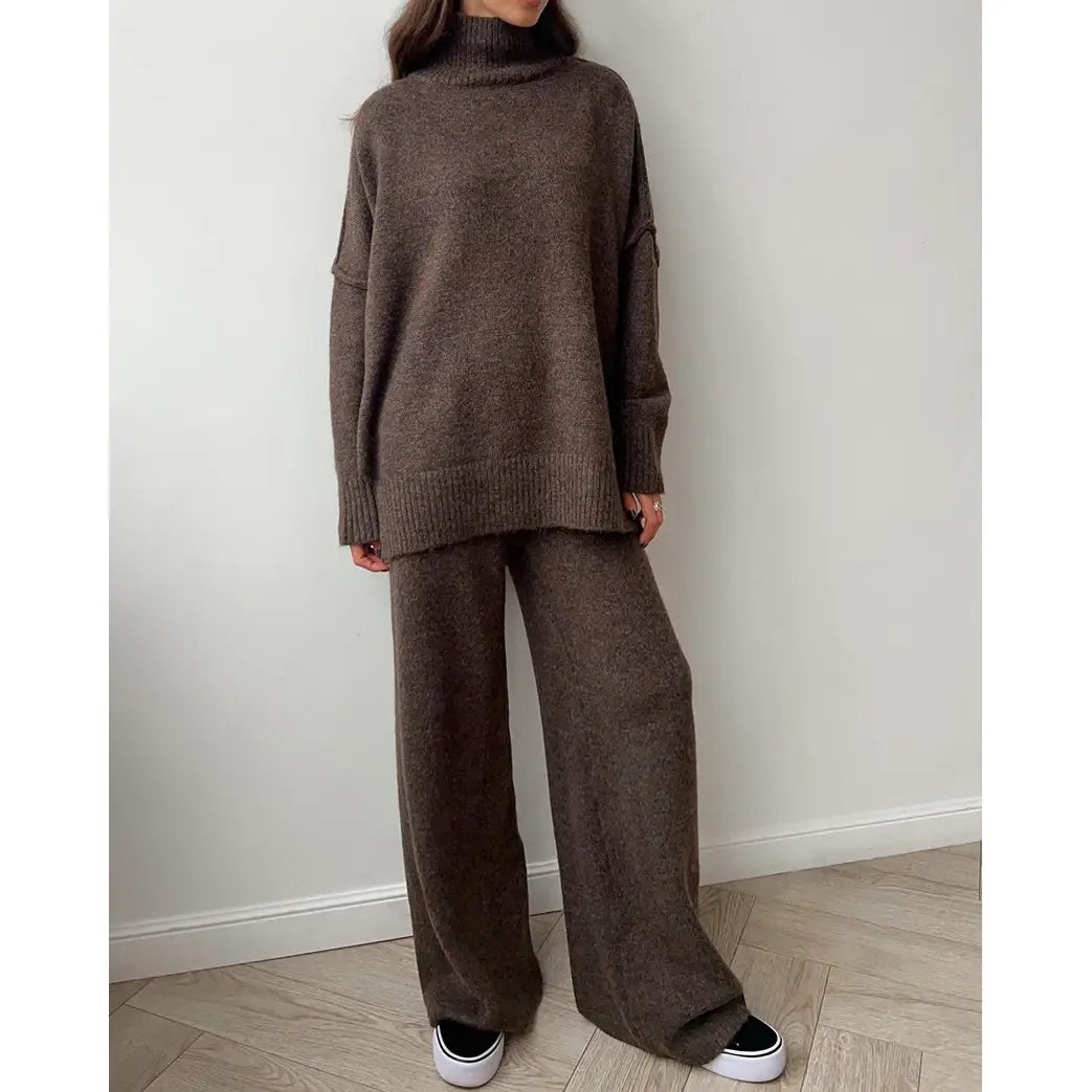 Woman wearing a lounge set in brown includes a soft turtleneck sweater paired with relaxed, flared pants for effortless comfort.