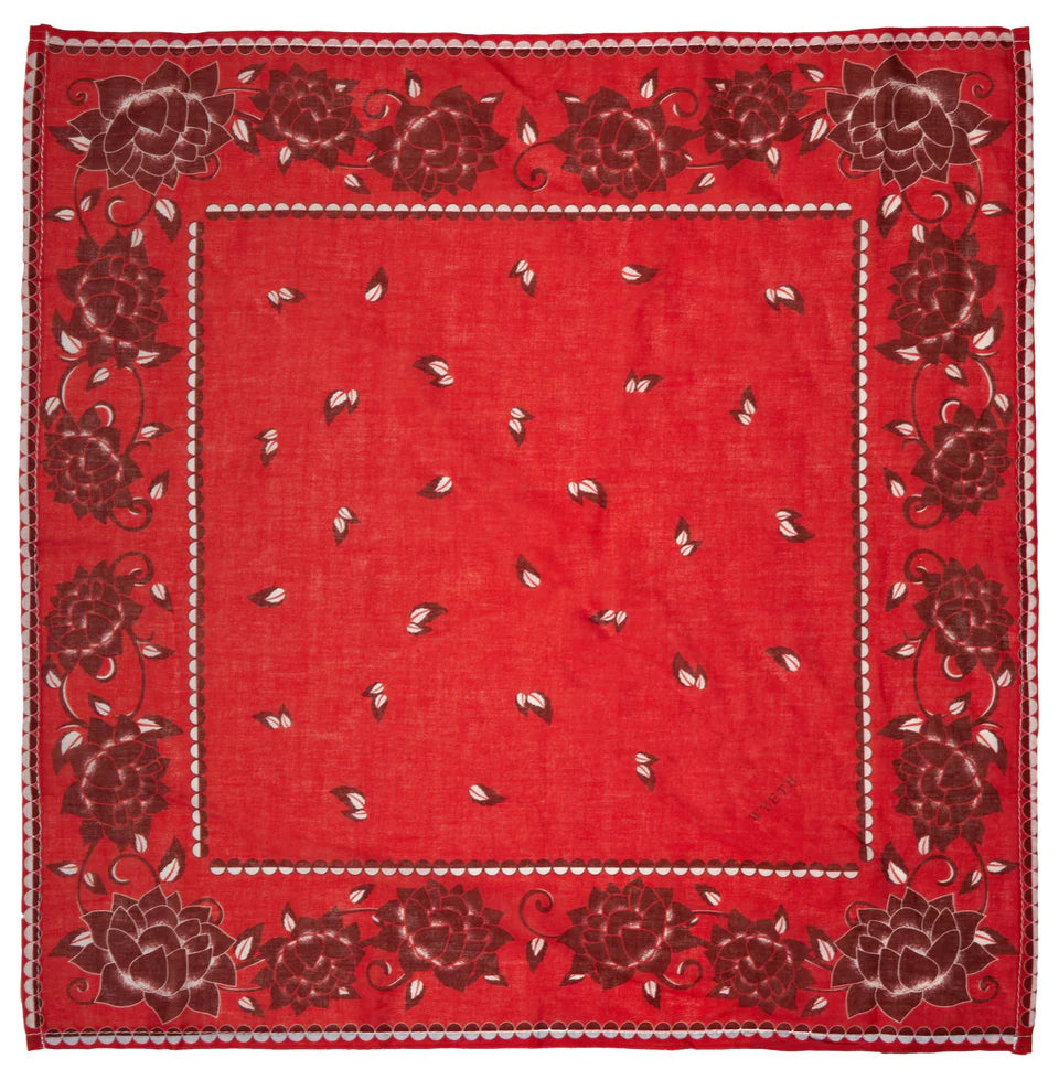 Red bandana with floral patterns on a white background