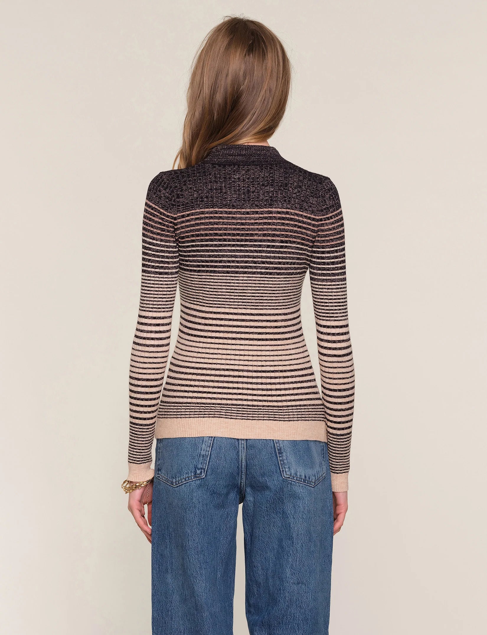 slim fit, crew neck sweater. It features an ombre stitch detail with a metallic thread throughout.