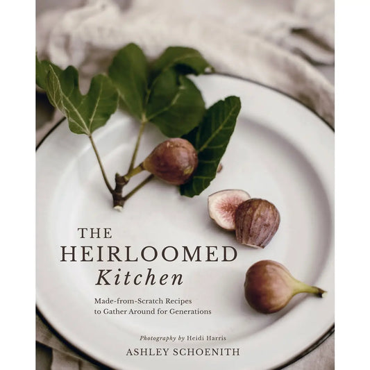 Book cover of 'The Heirloomed Kitchen' with figs on a plate