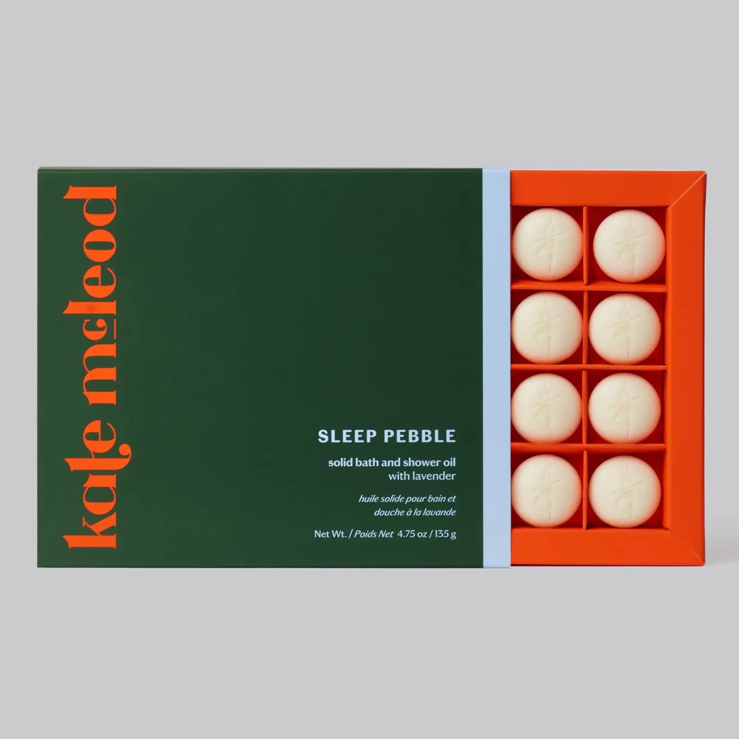 Box of Kate McLeod Sleep Pebble solid bath and shower oil with green label and orange packaging.