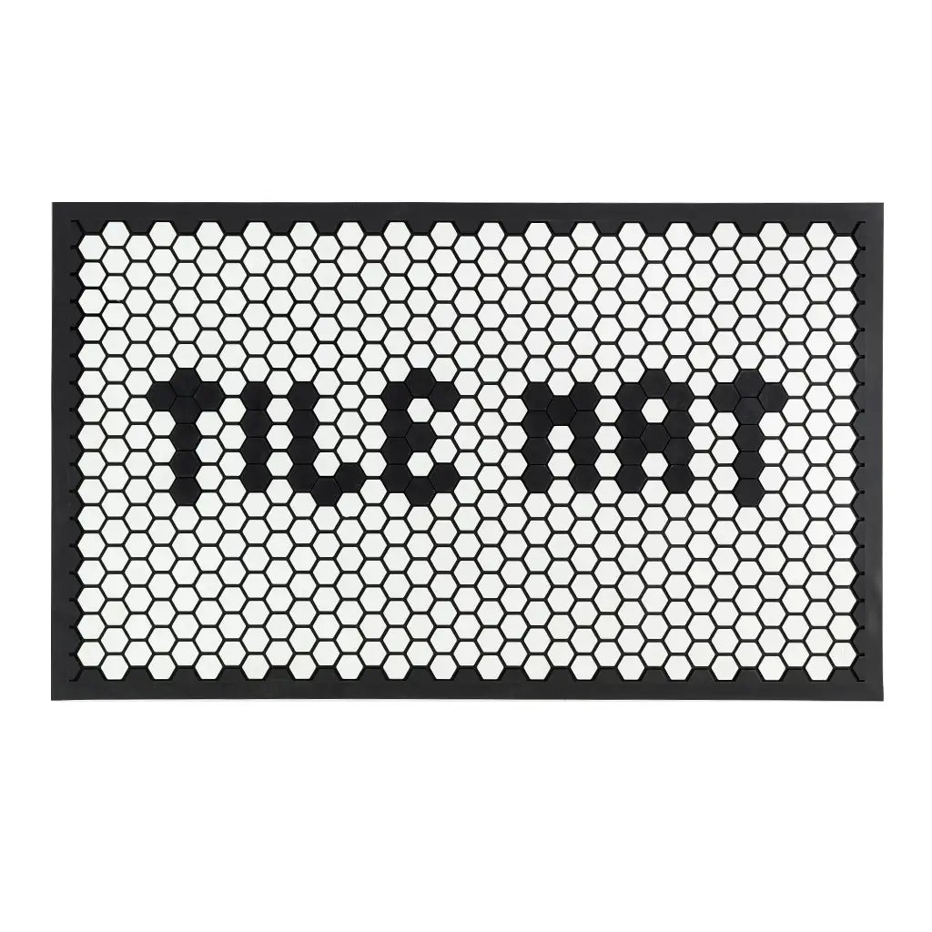Doormat with honeycomb pattern and 'WELCOME' text on a white background