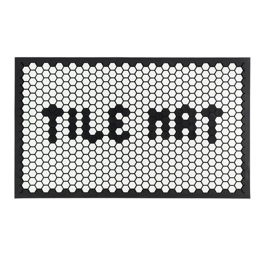 Doormat with honeycomb pattern and 'WELCOME' text on a white background