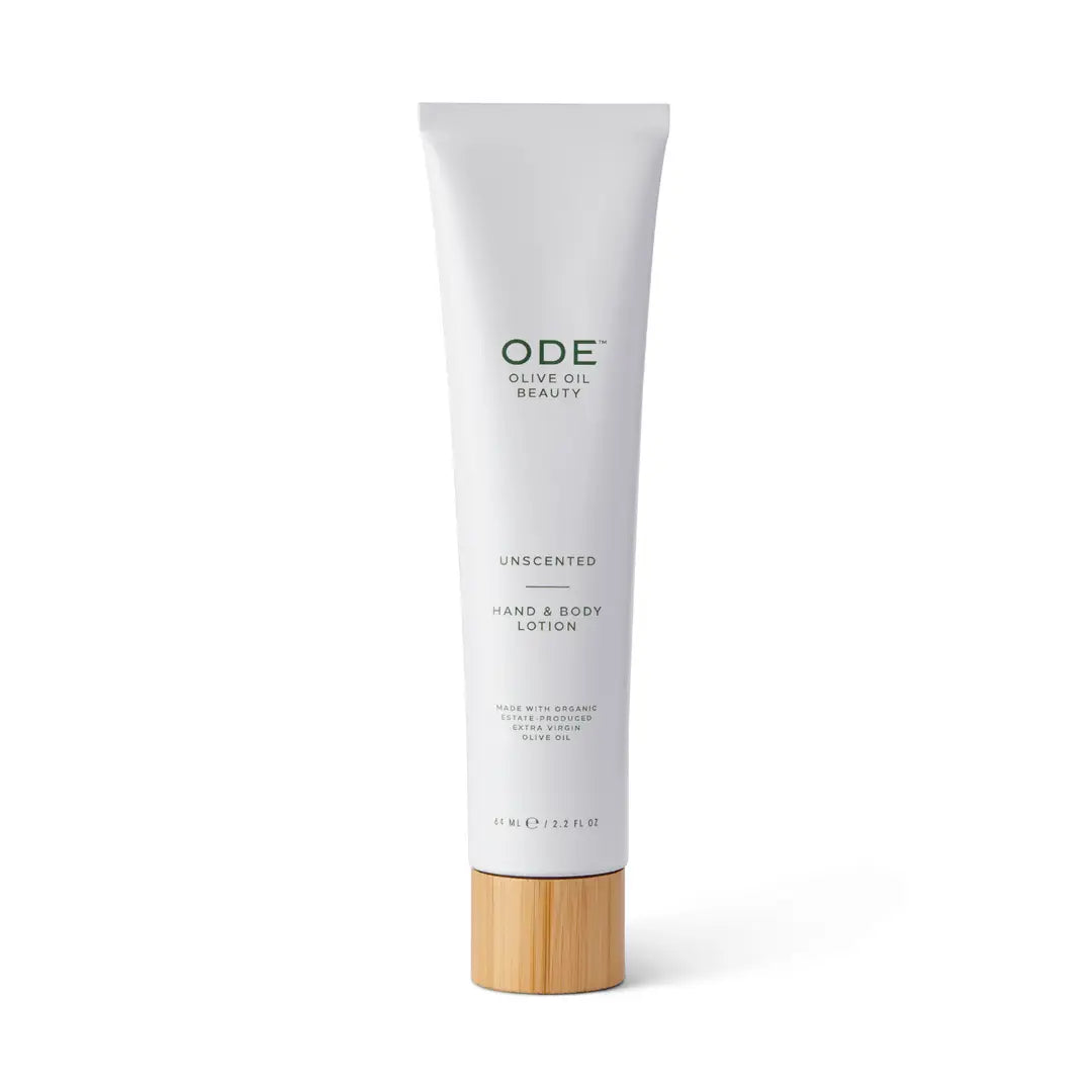 Tube of ODE unscented hand and body lotion with a wooden cap on a white background