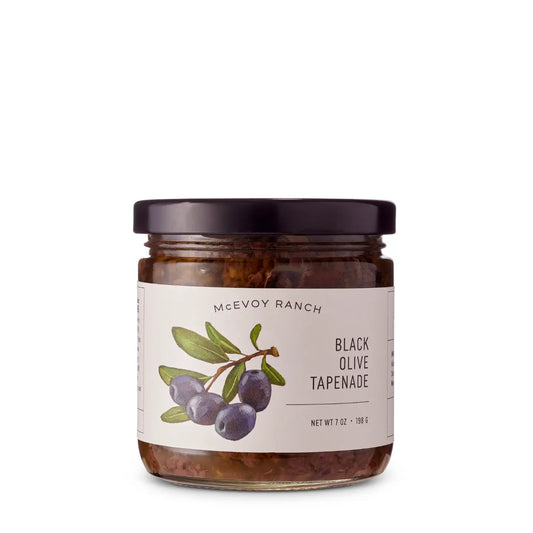 Jar of Black Olive Tapenade on a white background