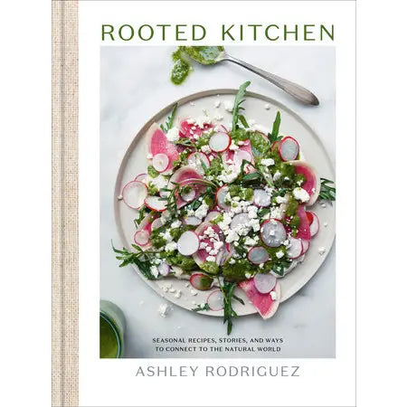 Book cover of 'Rooted Kitchen' by Ashley Rodriguez featuring a plate of salad.