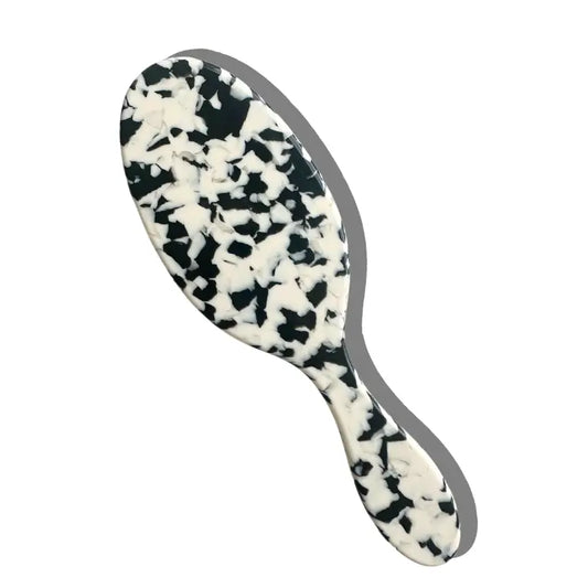 Hairbrush with black and white pattern on a white background